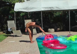 Missy Maze is lounging naked in the pool in this video